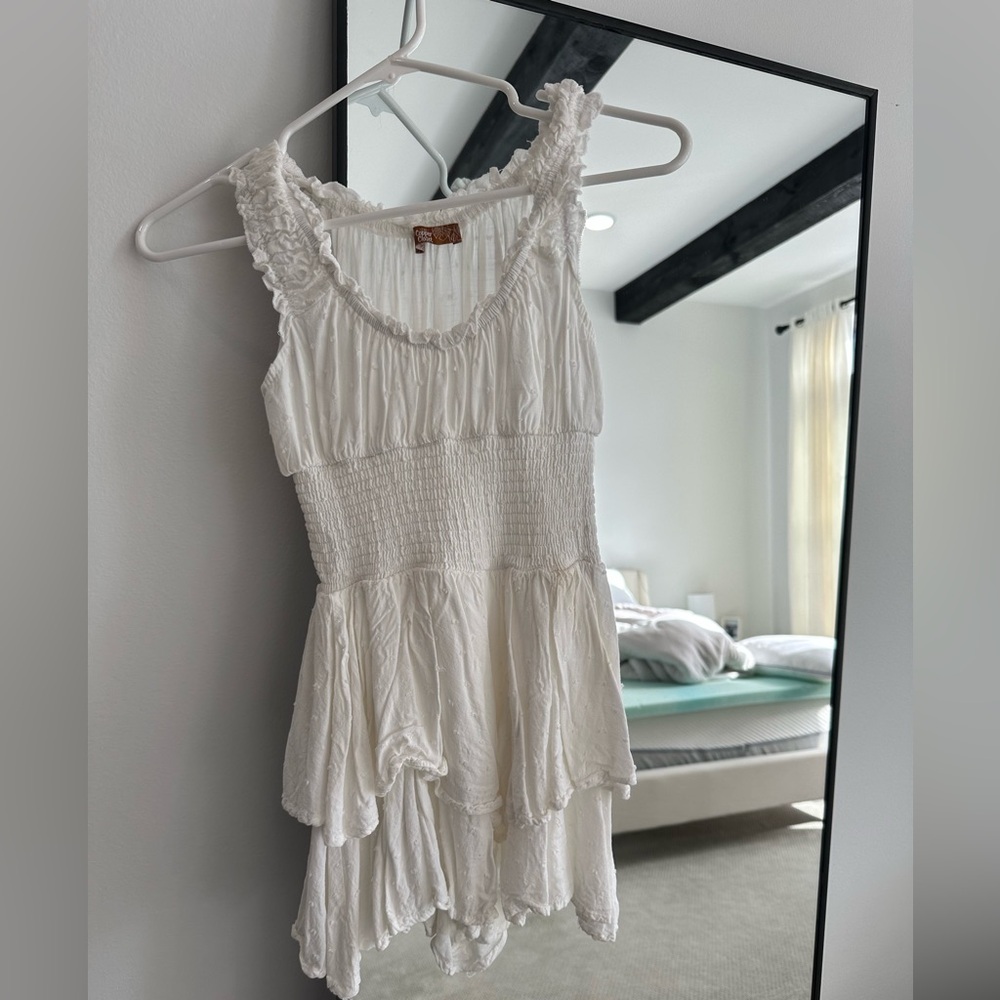 White ruffled romper dress with tiered skirt